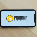 Piranha Games logo on a mobile phone