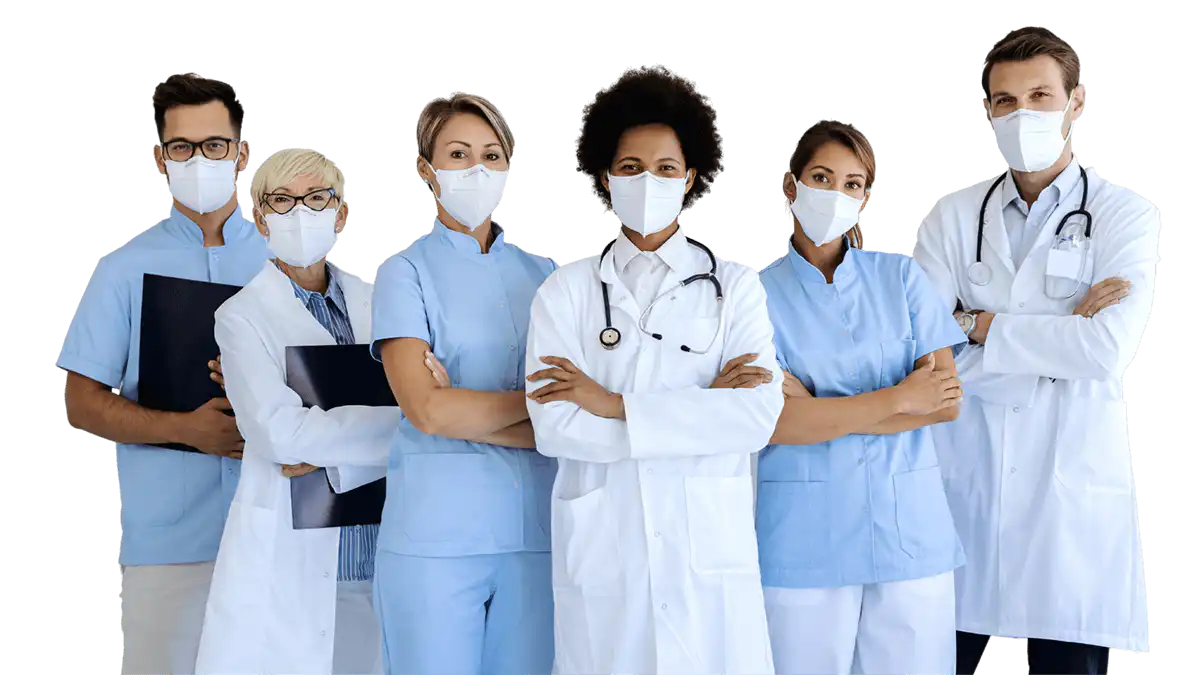 A line of nurses and doctors standing, wearing masks