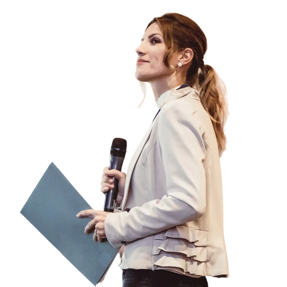 A person holding a microphone and presenting