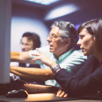 Employees working in a sound studio