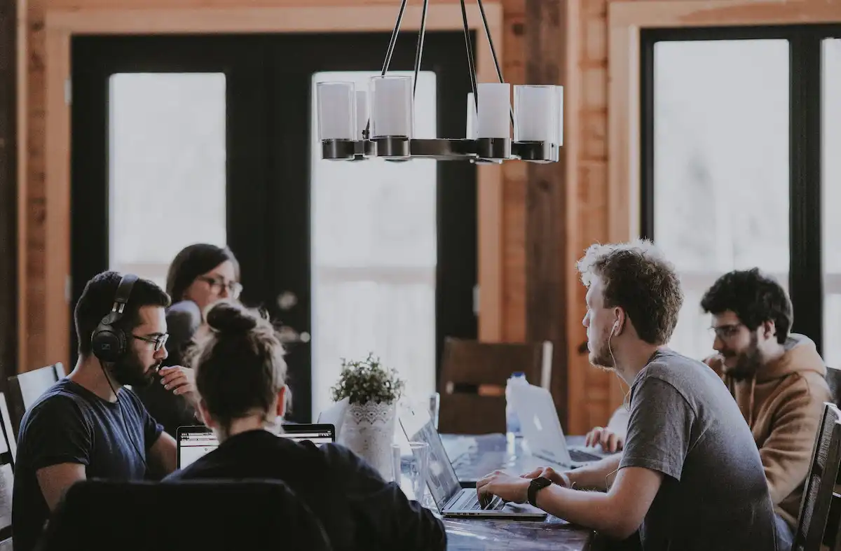 A group of diverse workers creating a multilingual survey