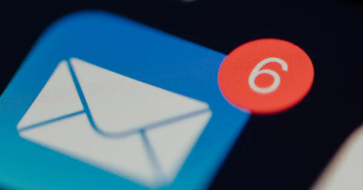 A smartphone screen showing a blue mail icon with a red notification badge displaying the number six, symbolizing respondent communication and data privacy.