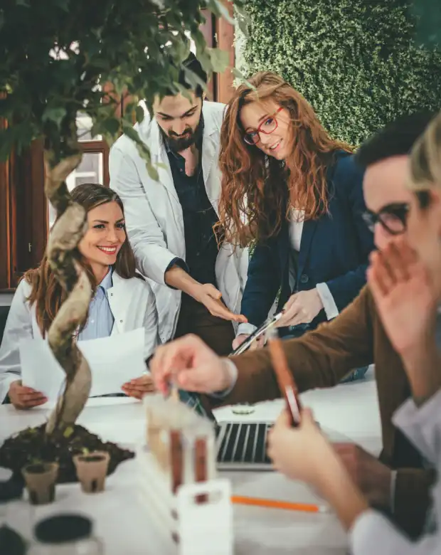 Colleagues sharing insights during a business meeting, highlighting Georgian professional language support