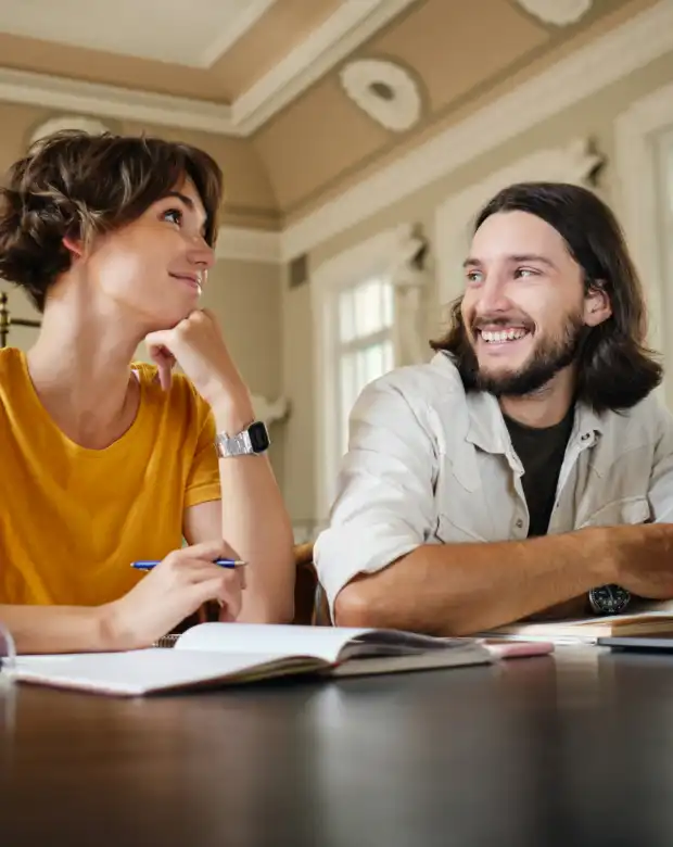 Focused business professionals reviewing documents, representing Macedonian linguistic services